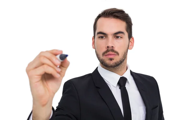 Focused businessman writing with marker Royalty Free Stock Images