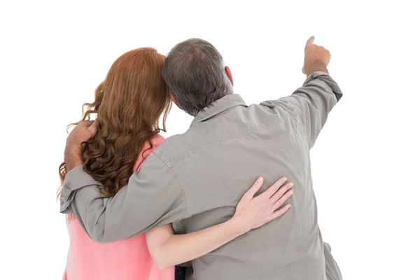 Casual couple pointing and looking — Stock Photo, Image