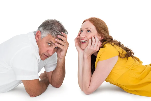 Casual couple lying on floor — Stock Photo, Image