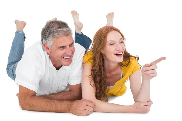 Casual couple lying on floor — Stock Photo, Image