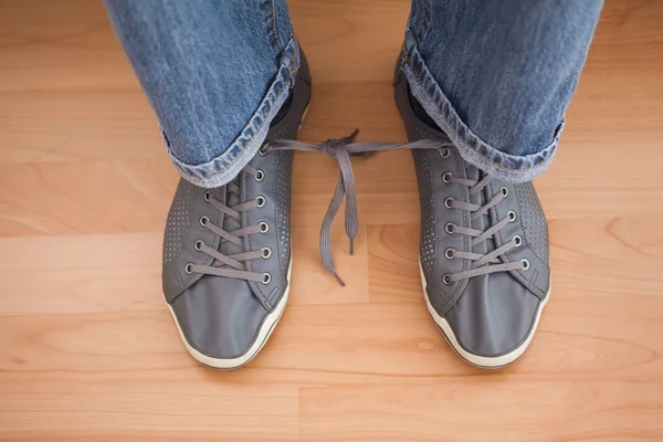 Casual mans shoelaces tied together — Stock Photo, Image