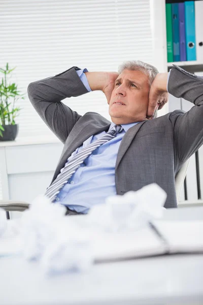 Stressed businessman covering his ears — Stock Photo, Image