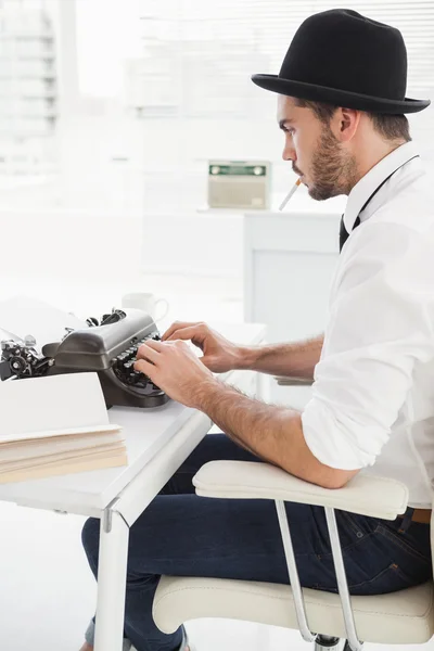 Hipster businessman using a typewriter — Stock Photo, Image