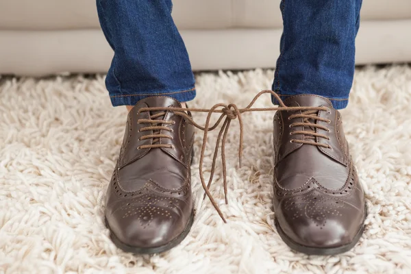 Classy mans shoelaces tied together — Stock Photo, Image