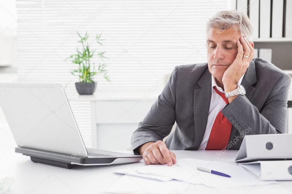 Tired businessman falling asleep at desk — Stock Photo © Wavebreakmedia