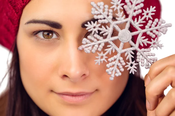 Close up of a brunette holding snowflake — Stock Photo, Image