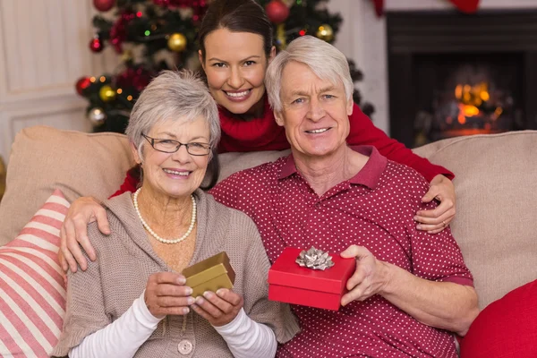 Mother posing with grandparents at christmas — Stock Photo, Image