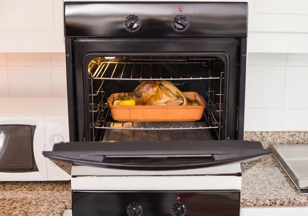 Roast turkey in oven for christmas dinner — Stock Photo, Image