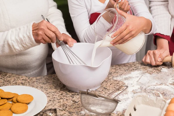 Multi-generation family baking together — Stock Photo, Image