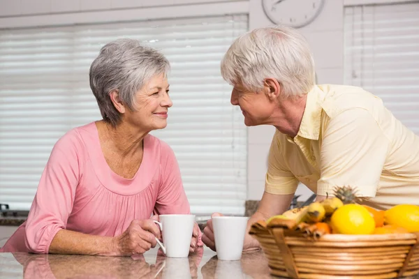 Senior couple having coffee together — Stock Photo, Image