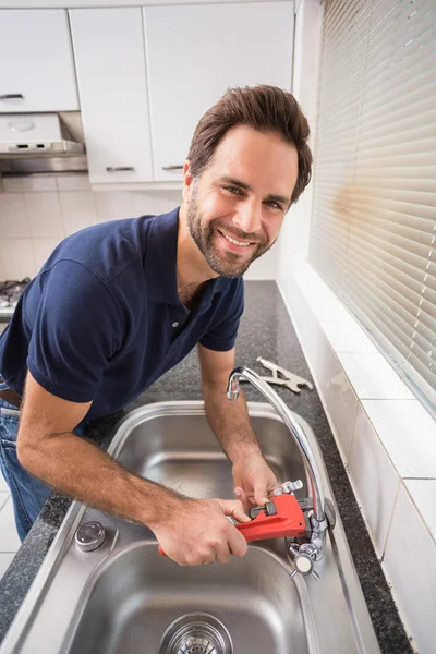 Man fixing tap with tool — Stock Photo, Image