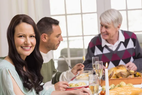 Smiling woman during christmas dinner Royalty Free Stock Images