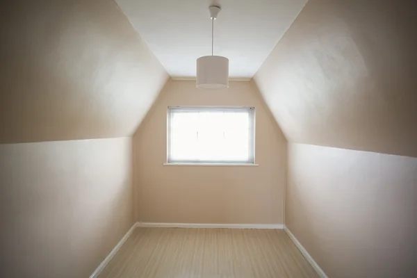 Empty attic room in cream and beige — Stock Photo, Image