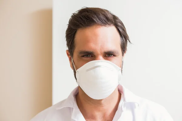 Carpenter wearing protective mask looking at camera — Stock Photo, Image