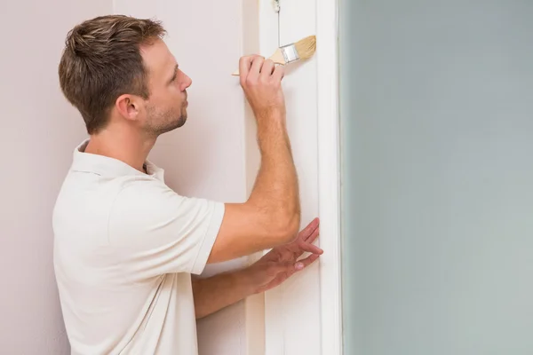 Painter painting the door white — Stock Photo, Image