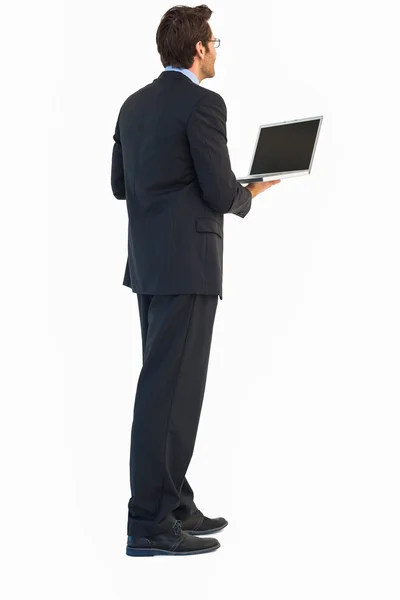 Hombre de negocios guapo usando un portátil — Foto de Stock