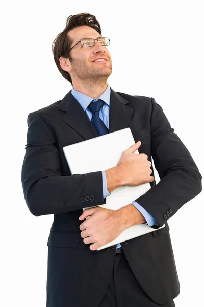 Bonito homem de negócios segurando seu laptop — Fotografia de Stock