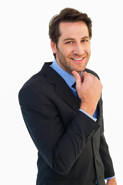 Businessman touching his chin — Stock Photo, Image