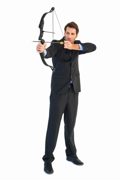 Businessman practicing archery — Stock Photo, Image