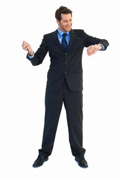 Smilling businessman watching the clock — Stock Photo, Image