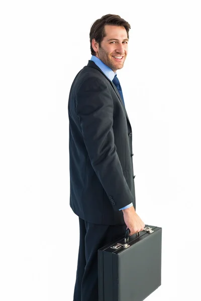 Bir evrak çantası elinde gülümseyen iş adamı — Stok fotoğraf