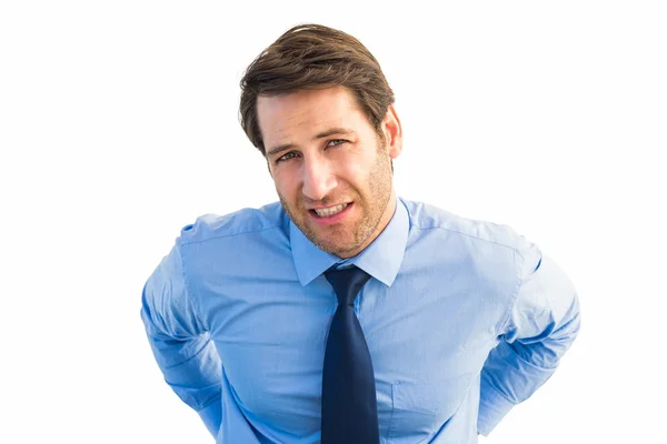 Handsome businessman with back pain standing — Stock Photo, Image