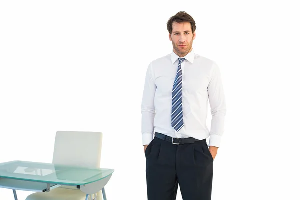 Businessman standing with hands in pockets — Stock Photo, Image