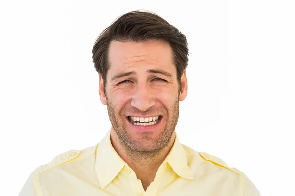 Desperate handsome man frowning at camera — Stock Photo, Image