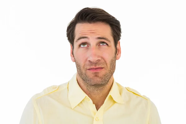 Handsome young man looking confused — Stock Photo, Image