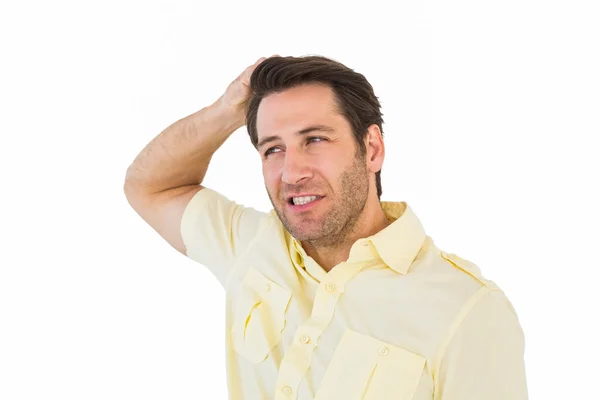 Hombre pensante posando con la mano detrás de la cabeza — Foto de Stock