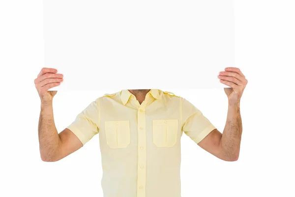 Man holding card in front of his face — Stock Photo, Image