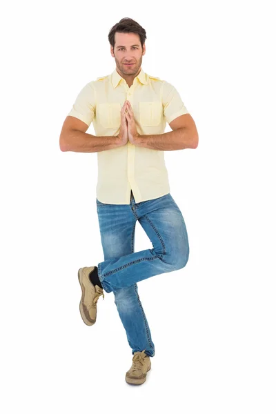 Handsome man doing the tree pose — Stock Photo, Image