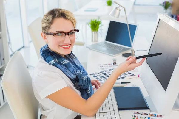 Attractive photo editor pointing at the screen — Stock Photo, Image
