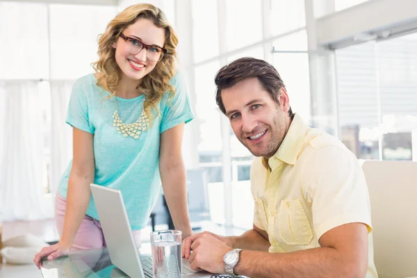 Smiling photo editors looking at camera — Stock Photo, Image