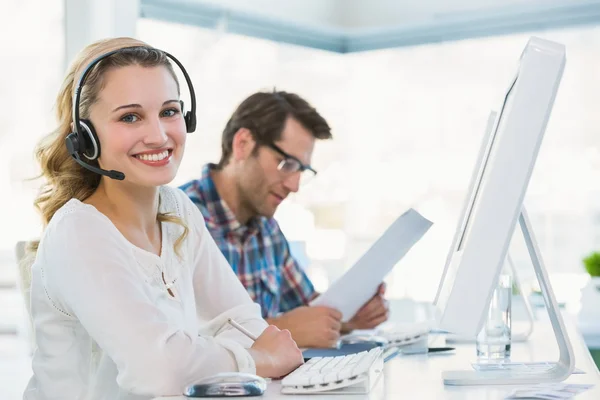 Pretty designer with headphone working on computer — Stock Photo, Image