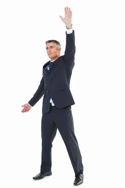 Smiling businessman doing a gesture — Stock Photo, Image