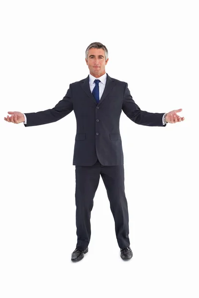 Cheerful businessman spreading his arms — Stock Photo, Image