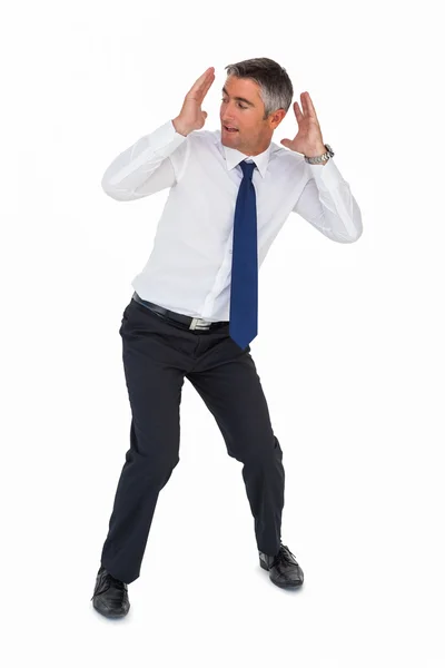 Businessman bending and with head between hands — Stock Photo, Image