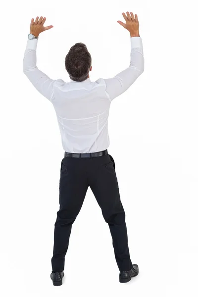 Rear view of a businessman pushing — Stock Photo, Image