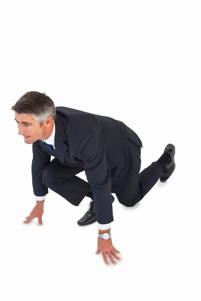 Businessman with hands and one knee on the floor — Stock Photo, Image