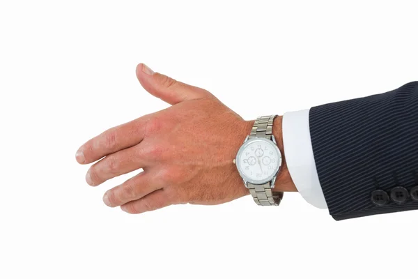 Empresário em terno oferecendo aperto de mão — Fotografia de Stock