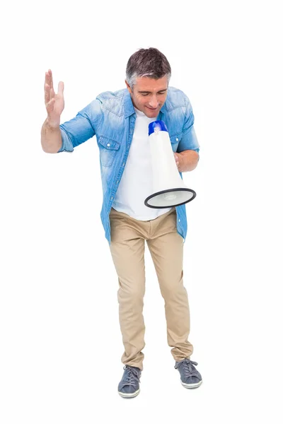 Man in casual clothes speaking on megaphone — Stock Photo, Image