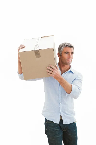 Smiling man carrying cardboard box — Stock Photo, Image