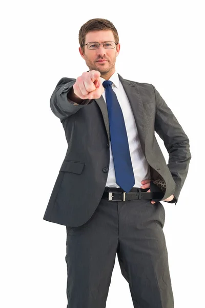 Frowning businessman pointing at camera — Stock Photo, Image