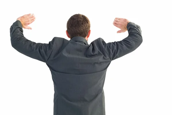 Businessman standing with hands up — Stock Photo, Image