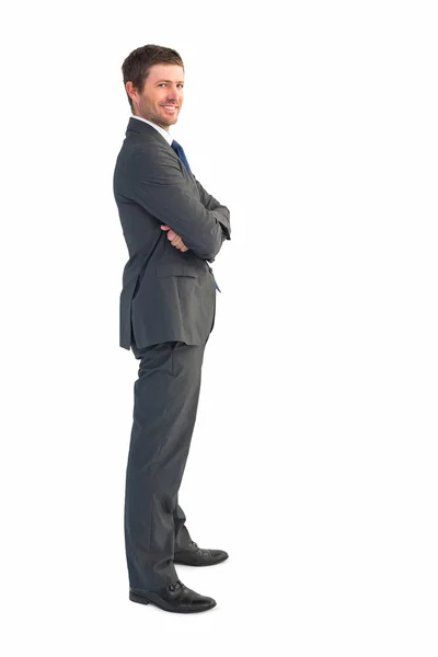 Businessman standing with arms crossed — Stock Photo, Image