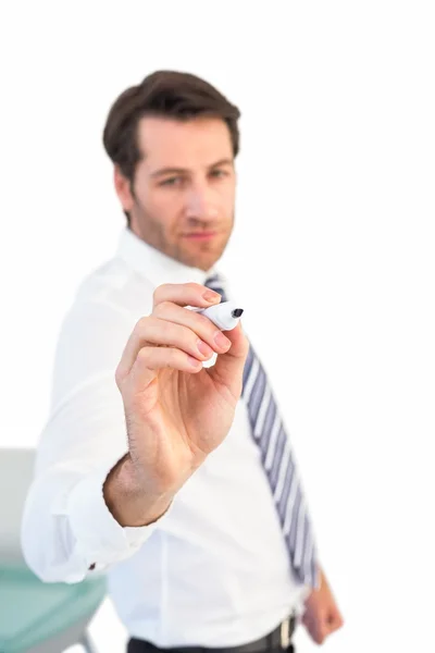 Focused businessman writing with marker Royalty Free Stock Photos