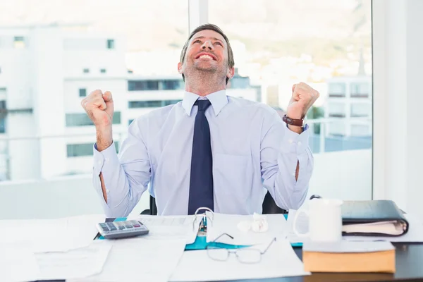 Cheering businessman at his desk — Stock Photo, Image