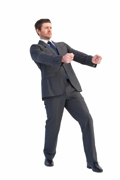 Hombre de negocios guapo tirando con las manos — Foto de Stock