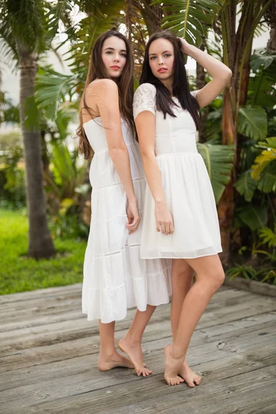 Pretty friends posing in white dresses — Stock Photo, Image